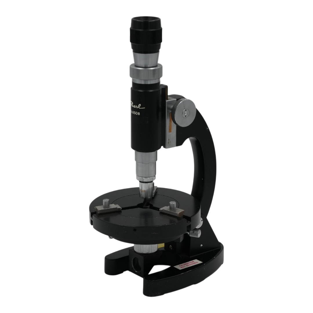 A black and silver microscope with a circular slide stage and adjustment knobs, shown on a plain white background.