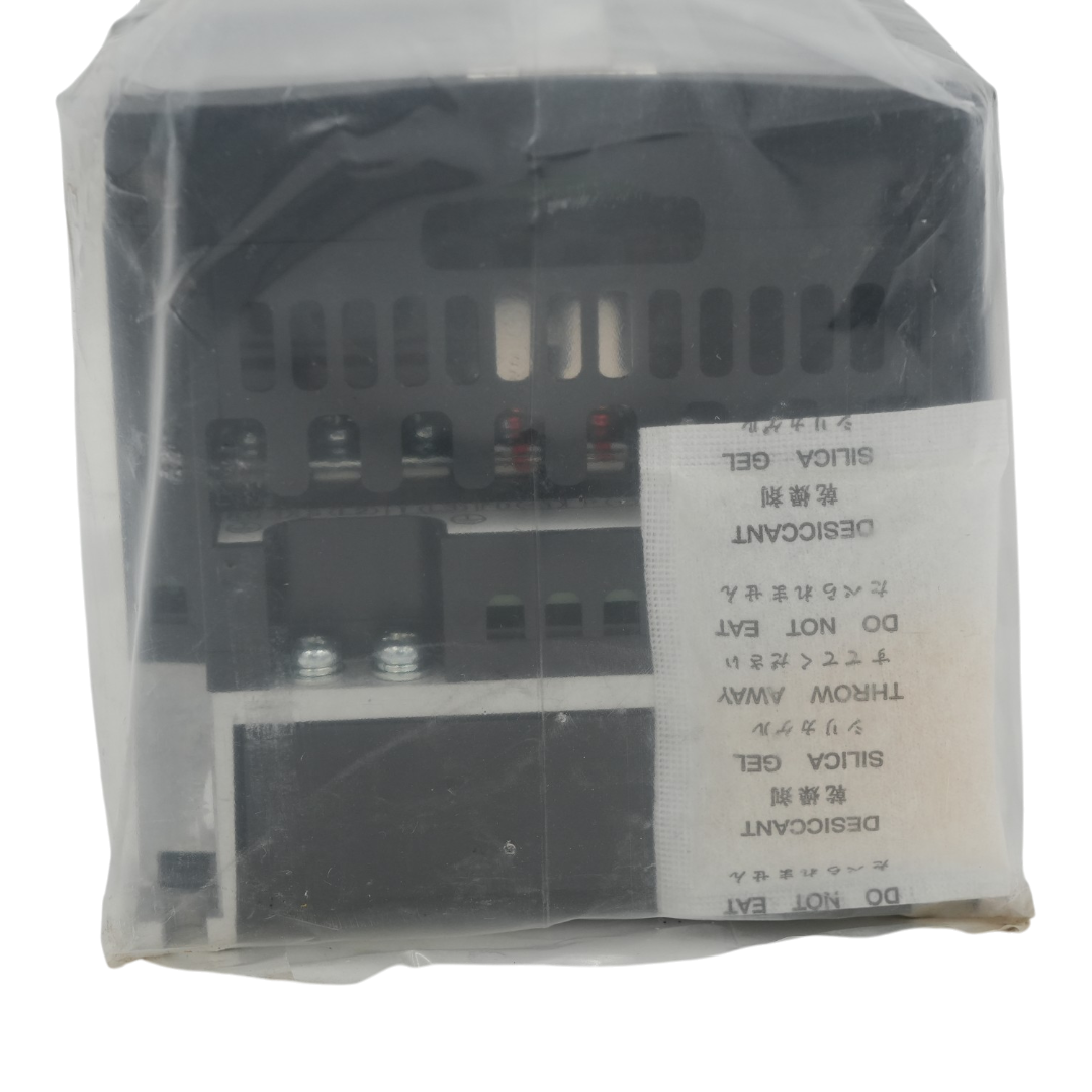 A packaged industrial black Hitachi VFD wrapped in a clear plastic protective sleeve on transparent background.